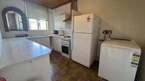 Fridge, stovetop - Two Bedroom Apartment at Kew (Kew)