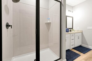 Shower, towels, soap, toilet paper