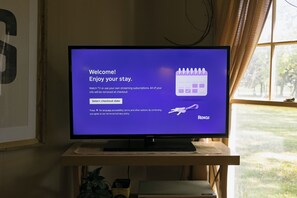 A television displaying a welcome message with a calendar icon and Roku logo.