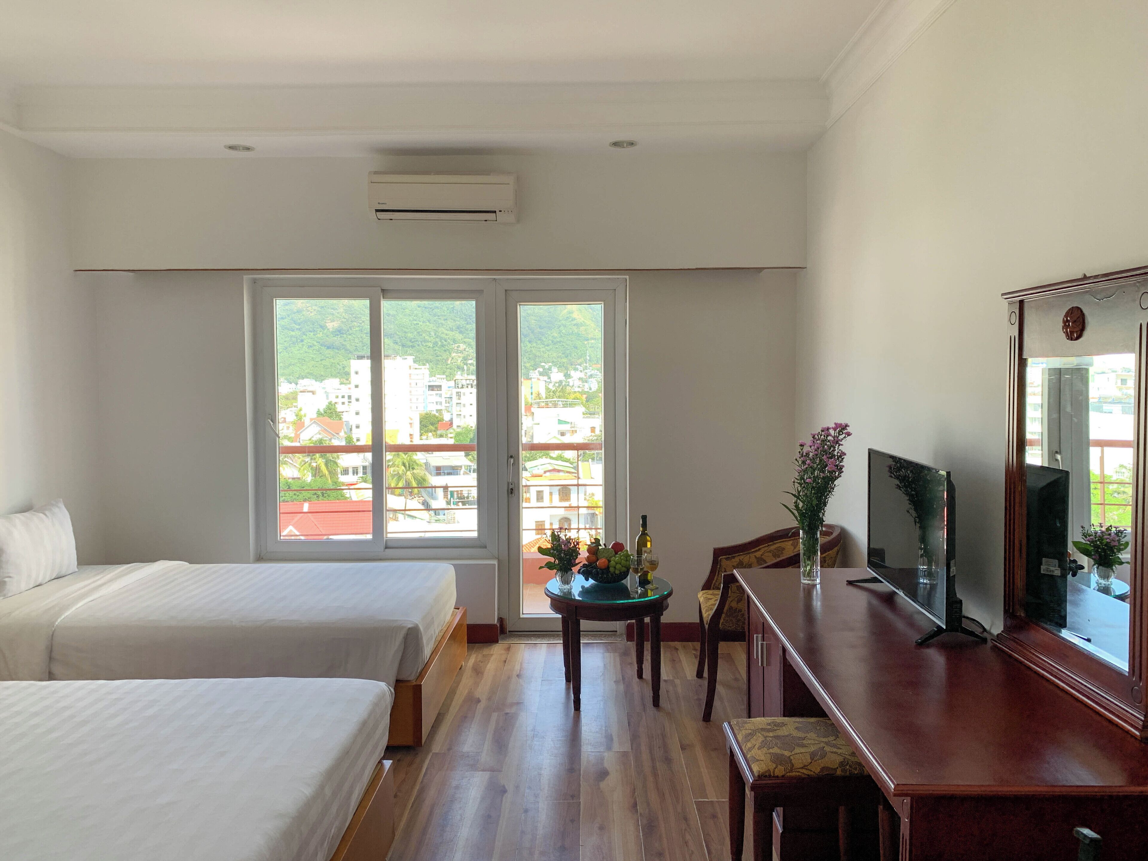 Family Room, Partial Ocean View | Minibar, in-room safe, desk, laptop workspace