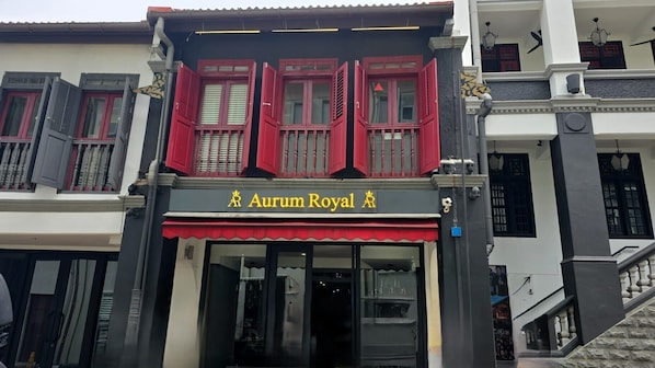 A building with a sign reading "Aurum Royal" and a staircase leading to an upper level. - Aurum Royal (Singapore)