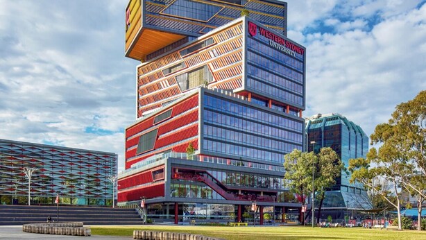 A modern building with a prominent sign for Western Sydney University. - Charming Big Family Home in Bankstown (Bankstown)