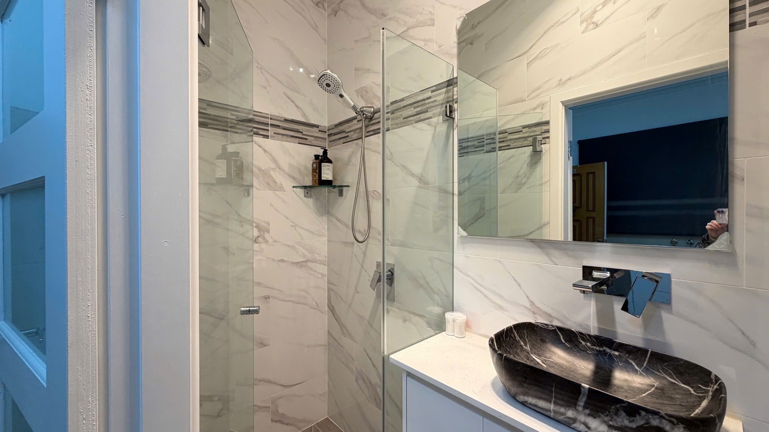 Shower, hair dryer, towels, soap