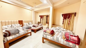 Family Room | Premium bedding, desk, laptop workspace, soundproofing - Hotel P & L near Mahakaleshwar Temple (Ujjain)