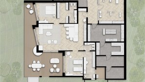 Plànol d'un hotel que mostra diverses habitacions, una zona de dinar i una cuina.