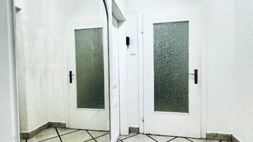 Basic Apartment | Bathroom | Shower, free toiletries, hair dryer, towels