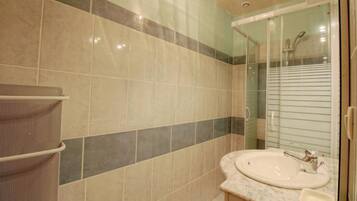 Shower, hair dryer, towels, toilet paper