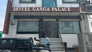 A multi-story building with a sign reading "HOTEL GANGA PALACE." - Hotel Ganga Palace (Agra)