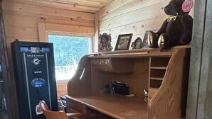 A wooden desk with a chair, a computer, and a teddy bear on the desk. - Perfect 3-bedroom house in Hope for a relaxing getaway (Hope)
