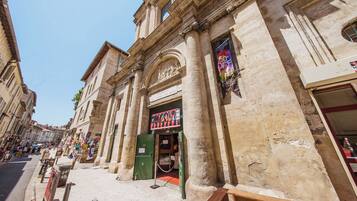 A historic building with classical architecture, including columns and an arched entrance.