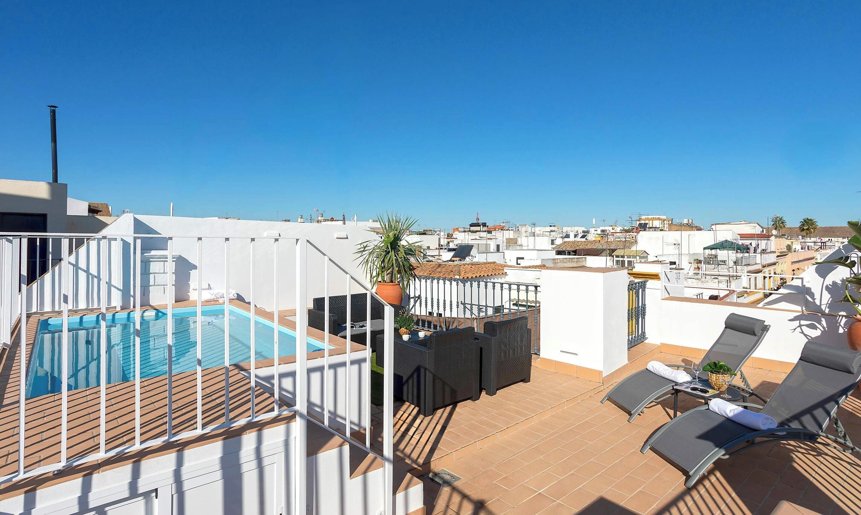 A rooftop pool with a clear view of the cityscape.