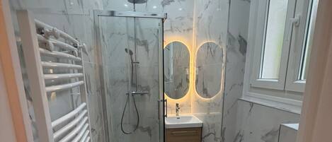 Shower, hair dryer, towels, toilet paper