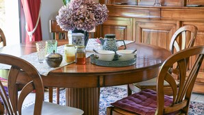 A dining table with chairs, a vase with flowers, and various dishes and condiments. - Bed and Breakfast 'Maison D'hotes Dolce Vita' with Mountain View, Shared Pool and Wi-Fi (Veyssilieu)
