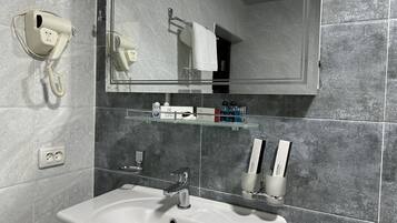 Standard Double Room, City View | Bathroom | Free toiletries, hair dryer, slippers, towels