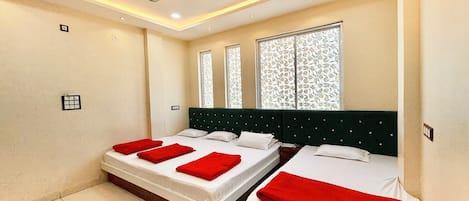 Deluxe Quadruple Room | Premium bedding, desk, laptop workspace, soundproofing