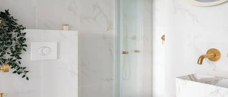 Shower, hair dryer, towels, soap