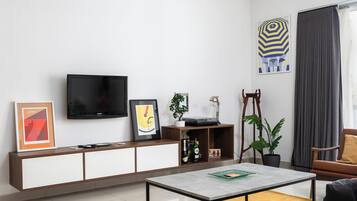 Apartamento, 2 quartos, cozinha | Área de estar | TV de tela plana