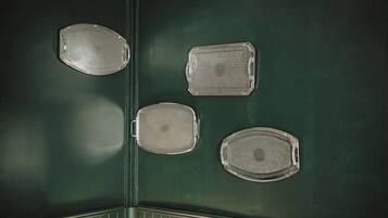 A green wall with four clear, textured panels.