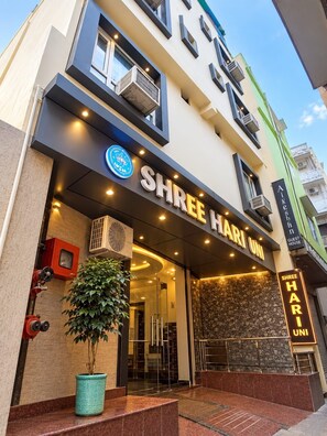 A hotel entrance with a sign reading 'Shree Hari Uni' and a logo above it. - Shree Hari Kunj (Varanasi)