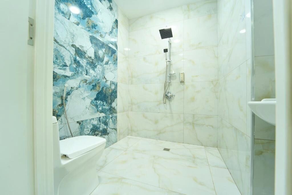 Shower, hair dryer, slippers, towels