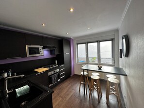 Comfort Apartment, Garden View | Private kitchen - Au 11811 Bel appartement cosy (Ans)