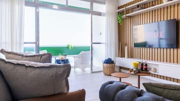 Apartment | Living area | 55-inch Smart TV with cable channels