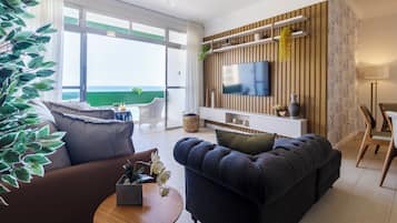 Apartment | Living area | 55-inch Smart TV with cable channels