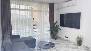65-inch Smart TV with cable channels, Netflix, streaming services - The Ocean Pearl Suites (Pattaya)