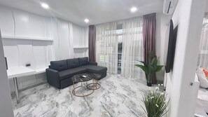 65-inch Smart TV with cable channels, Netflix, streaming services - The Ocean Pearl Suites (Pattaya)