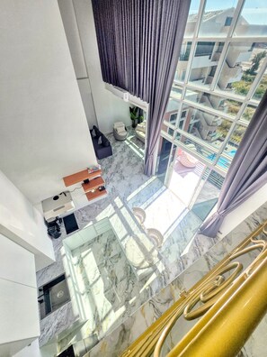 Exclusive Apartment, Balcony, Sea View | Living area | 65-inch Smart TV with cable channels, Netflix, streaming services