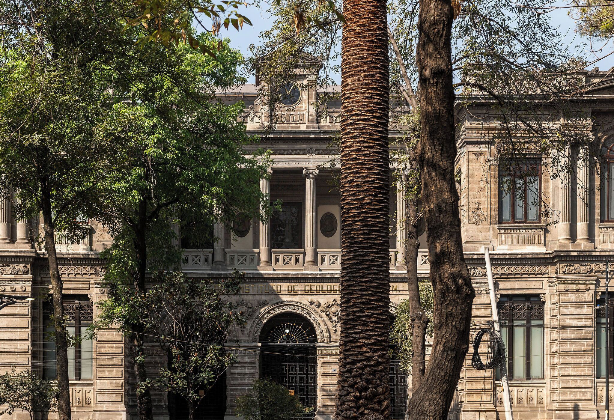 A historic building with classical architecture, including columns and detailed stonework.