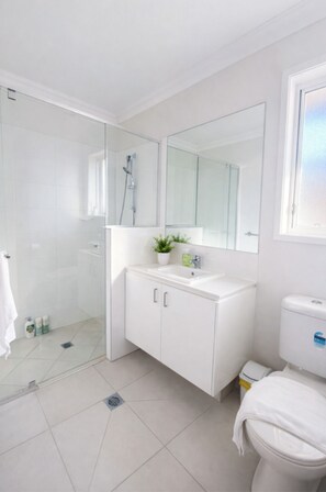 Hair dryer, towels, toilet paper - Elegant Modern Home in Park Ridge | Light-Filled Living (Park Ridge)