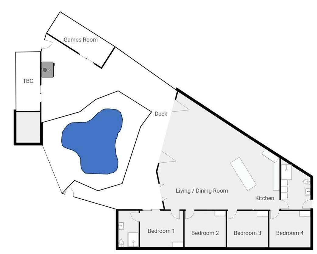 A floor plan with a games room, deck, living/dining room, kitchen, and four bedrooms.