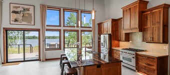 Escape to Lakeview Paradise, a luxury 4-bed, 3-bath lakefront retreat in Tripoli, WI. Each bedroom has a king bed, and the 2,560 sq. ft. home features high-end finishes, cozy comforts, and stunning lake views from a private 24-ft deck or hot tub.