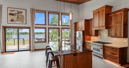 Escape to Lakeview Paradise, a luxury 4-bed, 3-bath lakefront retreat in Tripoli, WI. Each bedroom has a king bed, and the 2,560 sq. ft. home features high-end finishes, cozy comforts, and stunning lake views from a private 24-ft deck or hot tub.