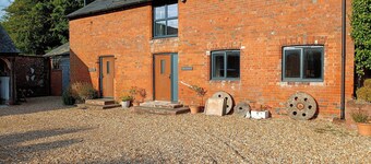 曼農農場牛棚度假屋  