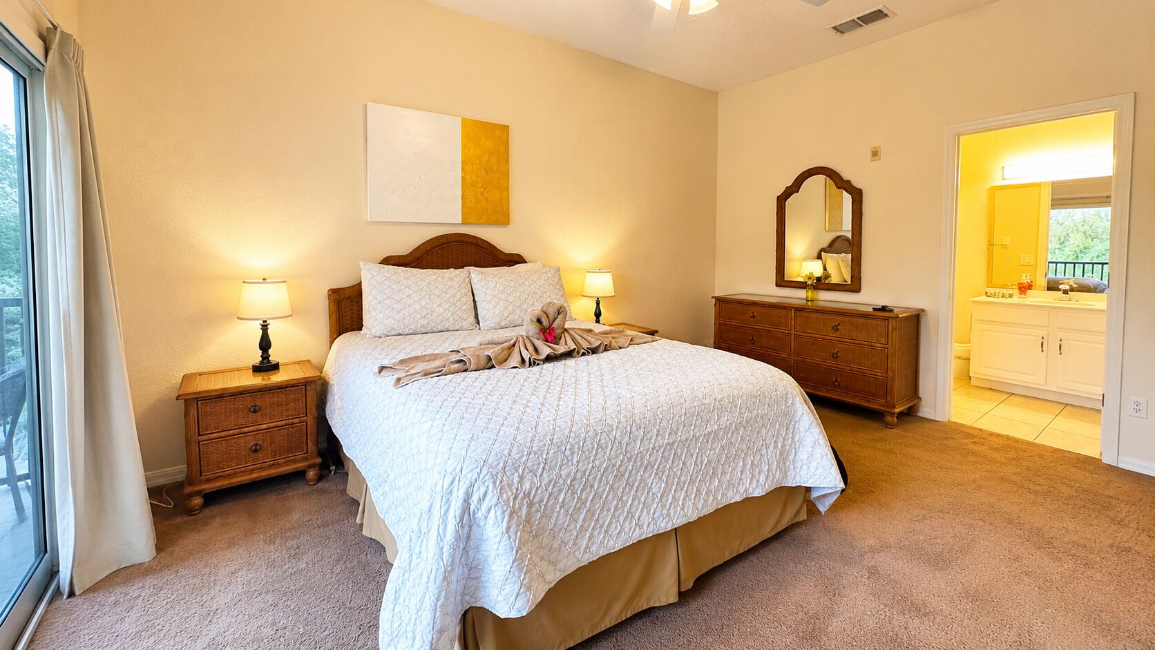 A bedroom with a bed, bedside tables, a dresser, a mirror, and a window with curtains.