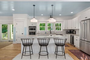 Fridge, microwave, oven, stovetop - Discover this stunning award-winning luxury 4br & 3.5 bath home in the OBX (Powells Point)