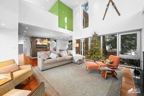 TV, fireplace, books - 4BR Luxury Ski Lodge | 3-Min Walk to Alyeska Lifts | Fireplace + Game Lounge (Girdwood)