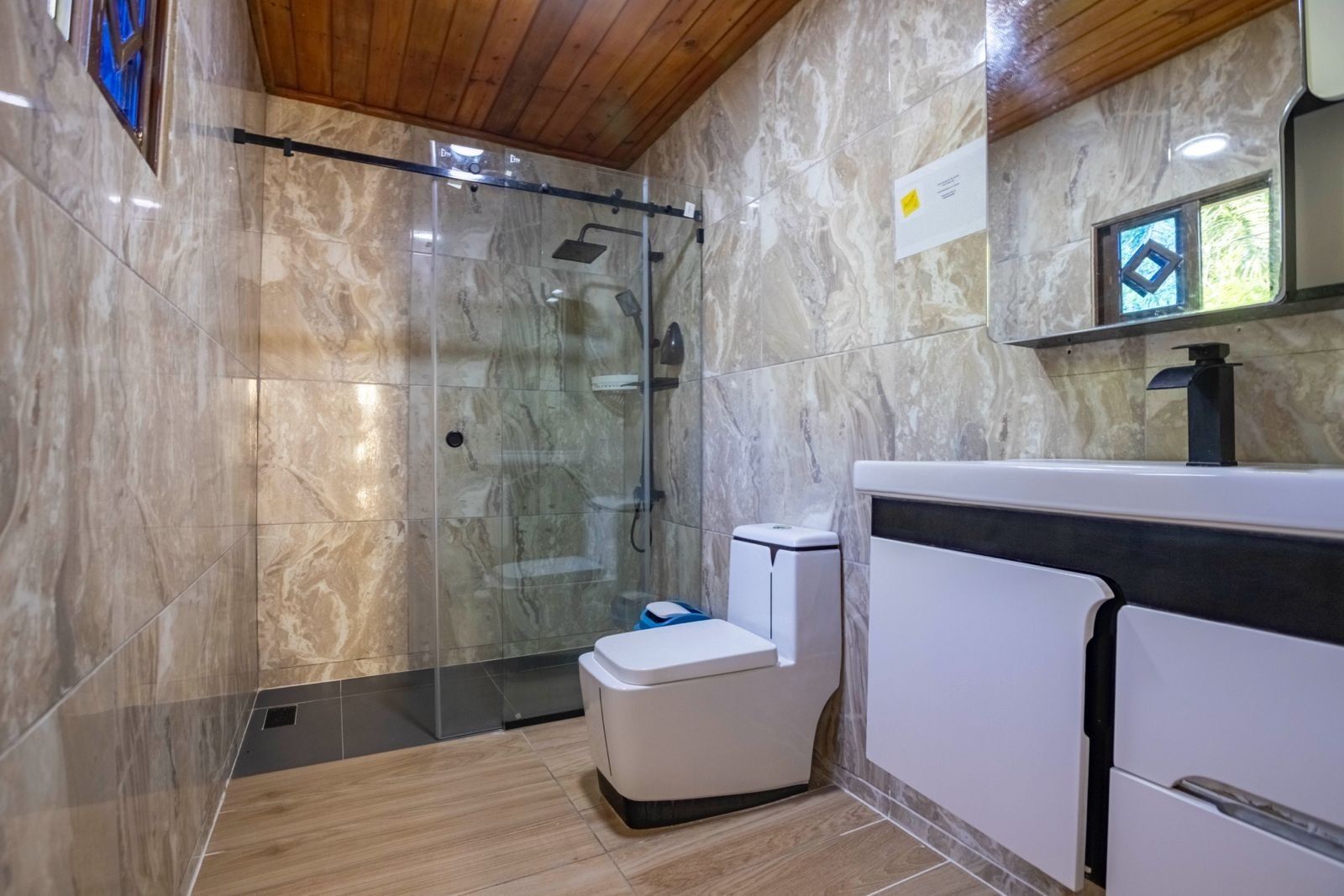 Shower, towels, soap, toilet paper