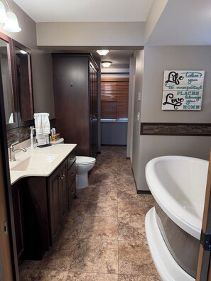 Shower, jetted tub, towels, soap