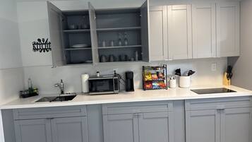 Fridge, microwave, stovetop, cookware/dishes/utensils