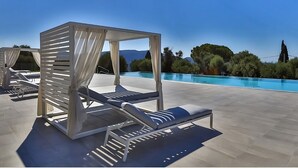 A rooftop pool area with modern sun loungers and a view of the surrounding landscape. - Le 120m2 - luxury, swimming pool, terrace and garage (Nice)