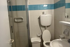 A bathroom with a toilet, sink, and shower. - Spring House, 2 min walk way from La Sorgente (Costa Paradiso)