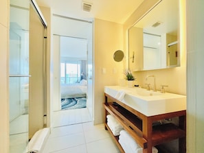 Shower, hair dryer, towels, soap