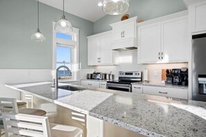 Fridge, microwave, oven, stovetop - The Beach Bear.com: 4 ensuite bedrooms with balconies, gulf views, private pool (Gulf County)