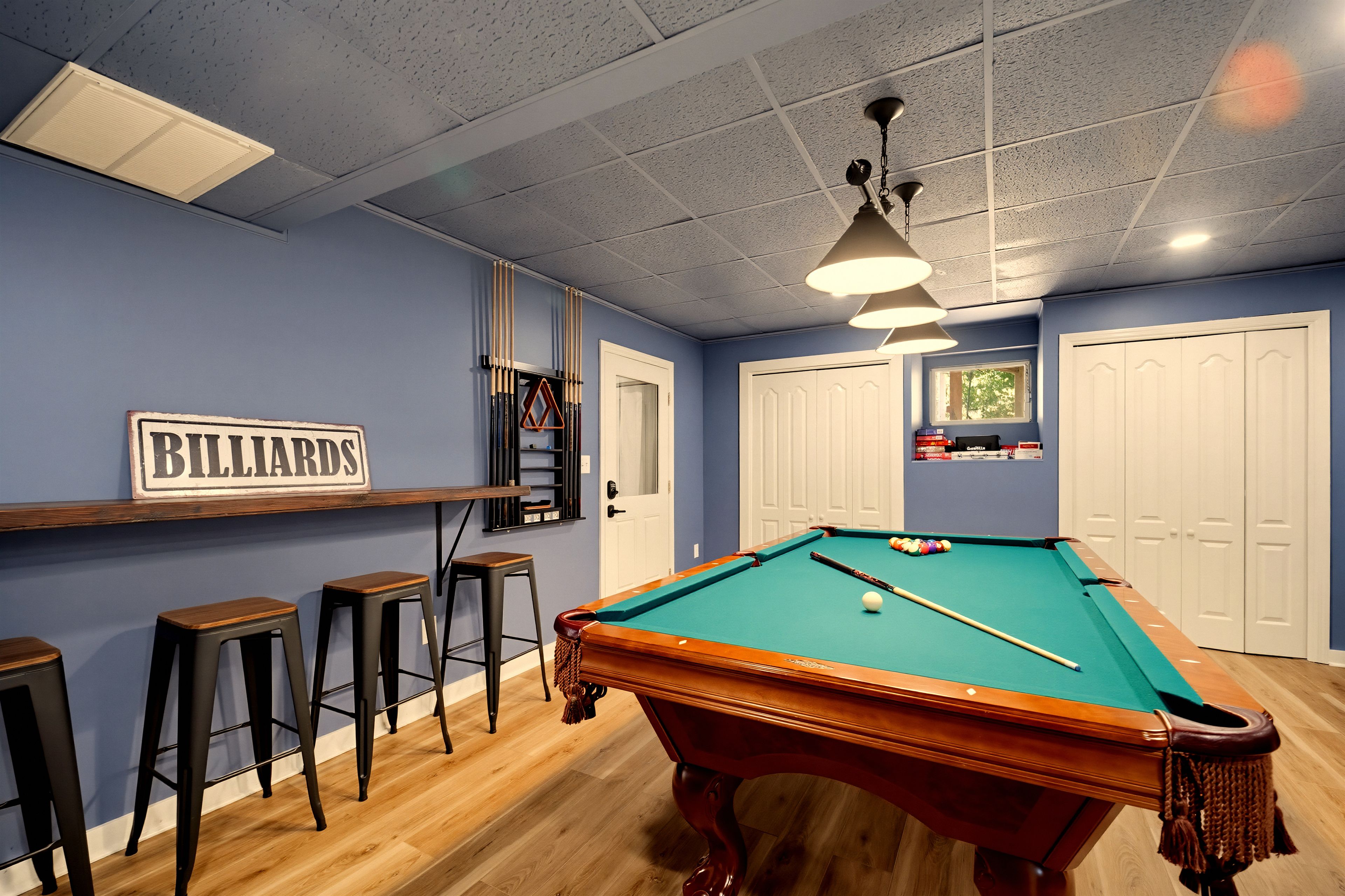 {Pool Table} Rack them up in the game room, where the pool table keeps the competition going long after dinner.