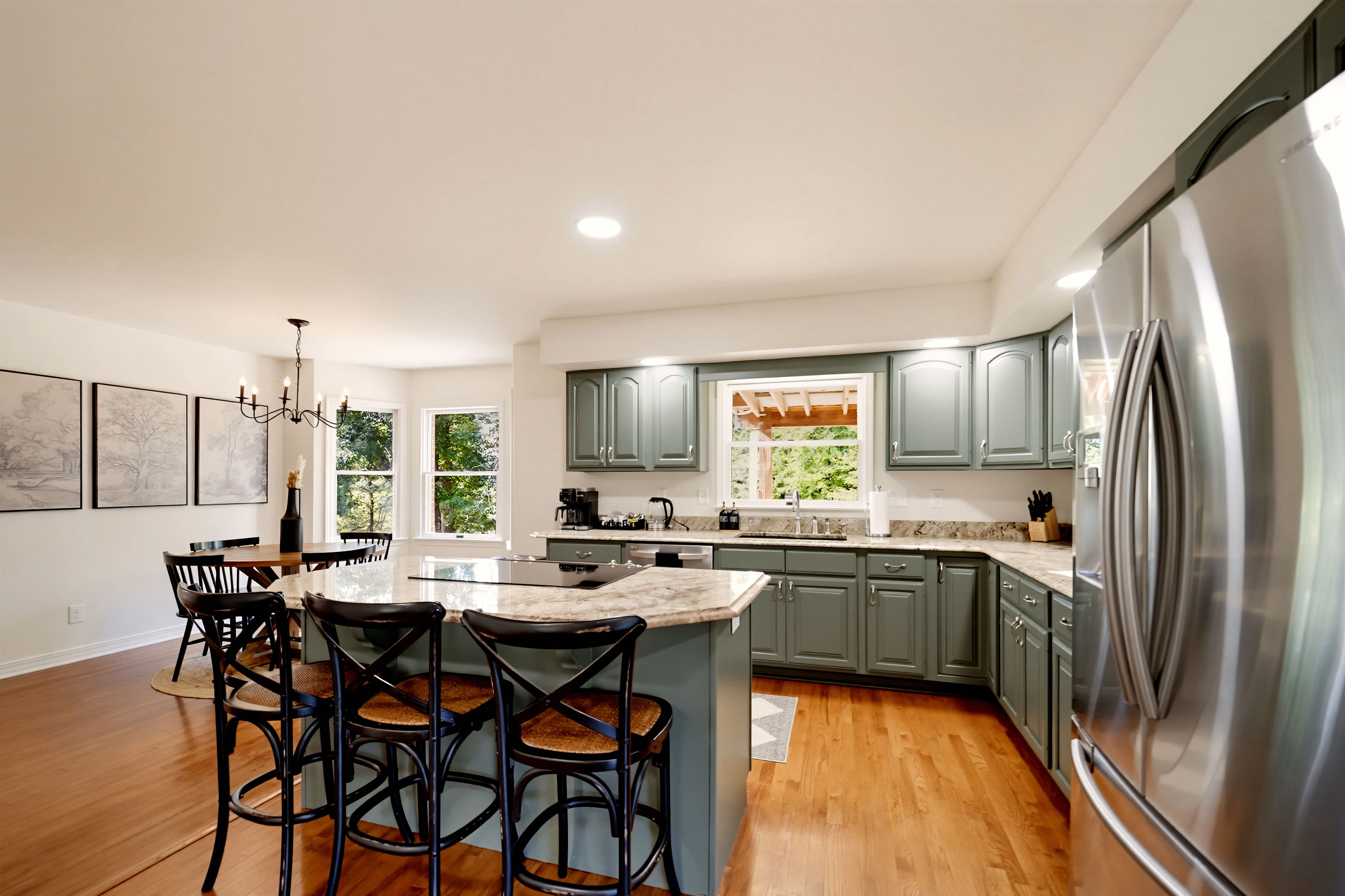 {Kitchen} Spacious and fully equipped for group cooking, with generous prep space, bar seating, and room for everyone to gather while meals come together.