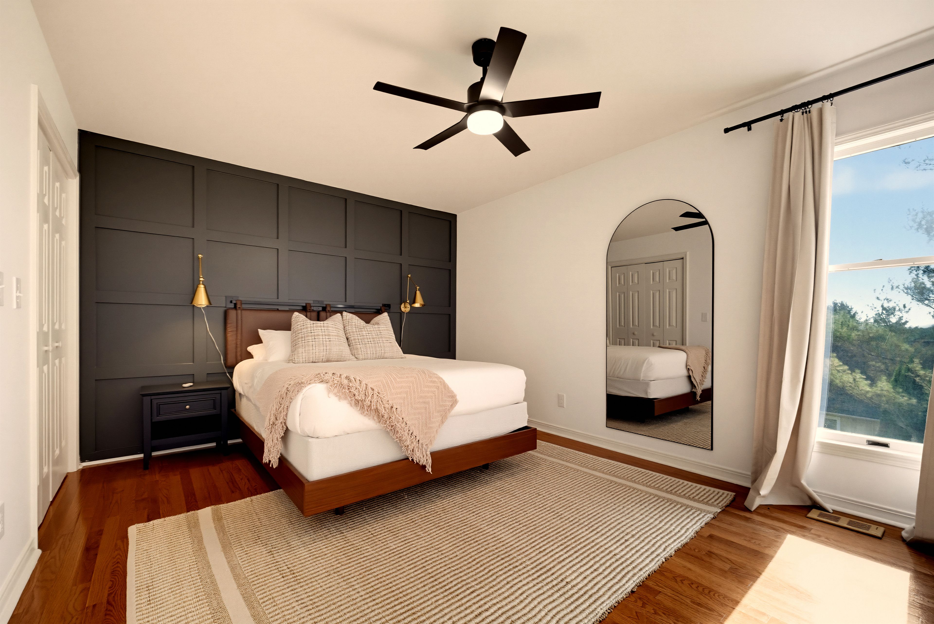 {Primary Suite} Retreat to the spacious primary suite with a king bed, warm modern finishes, and a calm place to recharge after a full day together.