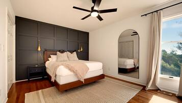 {Primary Suite} Retreat to the spacious primary suite with a king bed, warm modern finishes, and a calm place to recharge after a full day together.